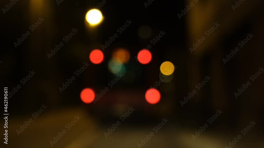 Night road lights blurred bokeh of cars in traffic on the road at night. Abstract bright blurred colored bokeh. Bokeh lights in the city night background. Traffic lights Night road lights blurred bokeh of cars in traffic on the road at night. Abstract bright blurred colored bokeh. Bokeh lights in the city night background. Traffic lights