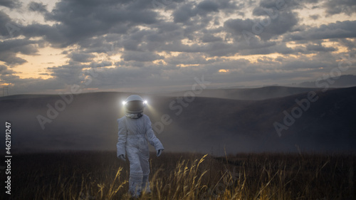 An astronaut in a spacesuit explores an unknown planet.