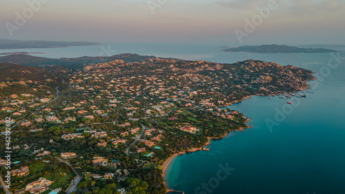 houses in paradise on italy island. directly on the inlet and with a flabbergasting white beach. ideal for swimming, bouncing or other water sports works out. warm light glimmers on the blue water