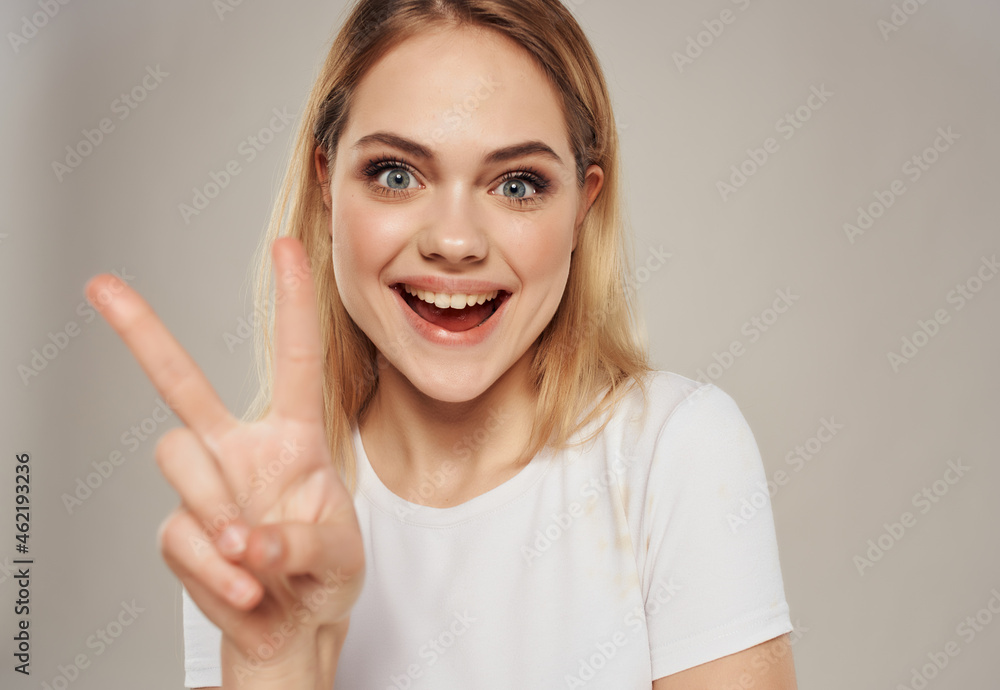 pretty blonde woman in t-shirt bright makeup close-up pretty blonde woman in t-shirt bright makeup close-up