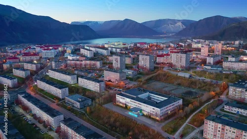 Kirovsk, Khibiny region in Russia. Aerial view of the town of Kirovsk and Khibiny mountains during twilight