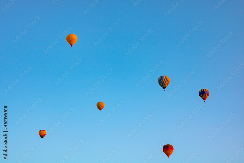 Hot air balloons on the sky in the morning. Magical view with hot air balloons. Hot air balloons on the sky in the morning. Magical view with hot air balloons.