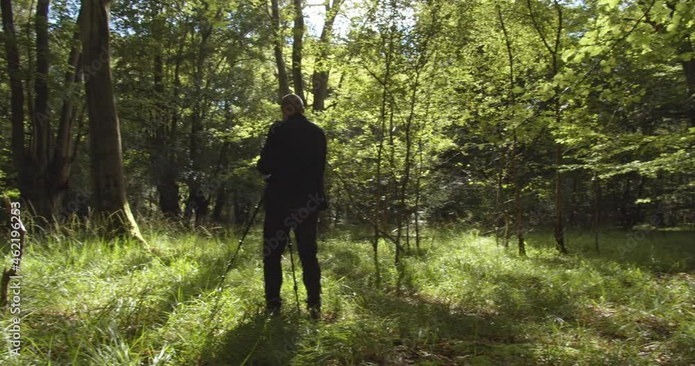 Cameraman Filming in Nature. Wide Pan Long Shot. Cameraman Filming in Nature. Wide Pan Long Shot.