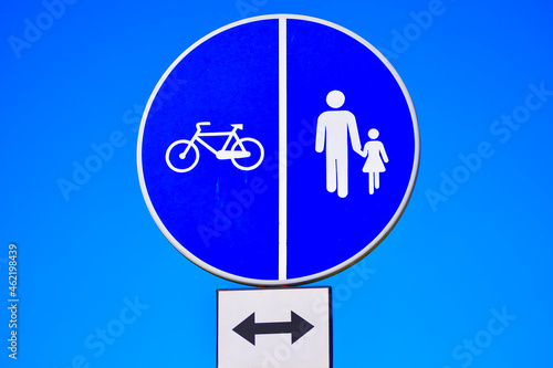 Sign for cyclists and adult child warning sign