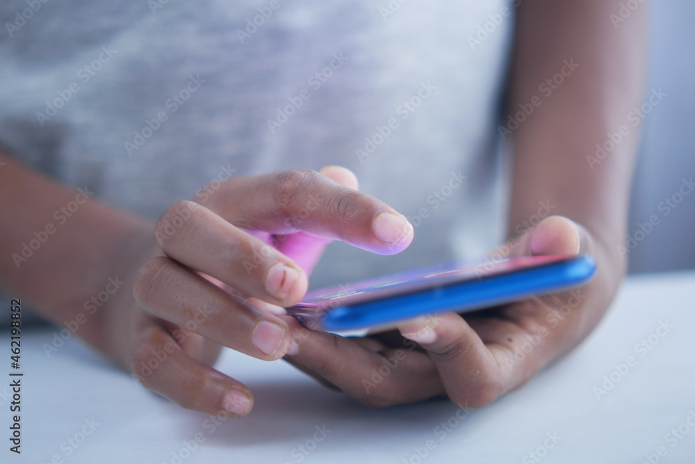 child hand pointing finger on smart phone screen. child hand pointing finger on smart phone screen.