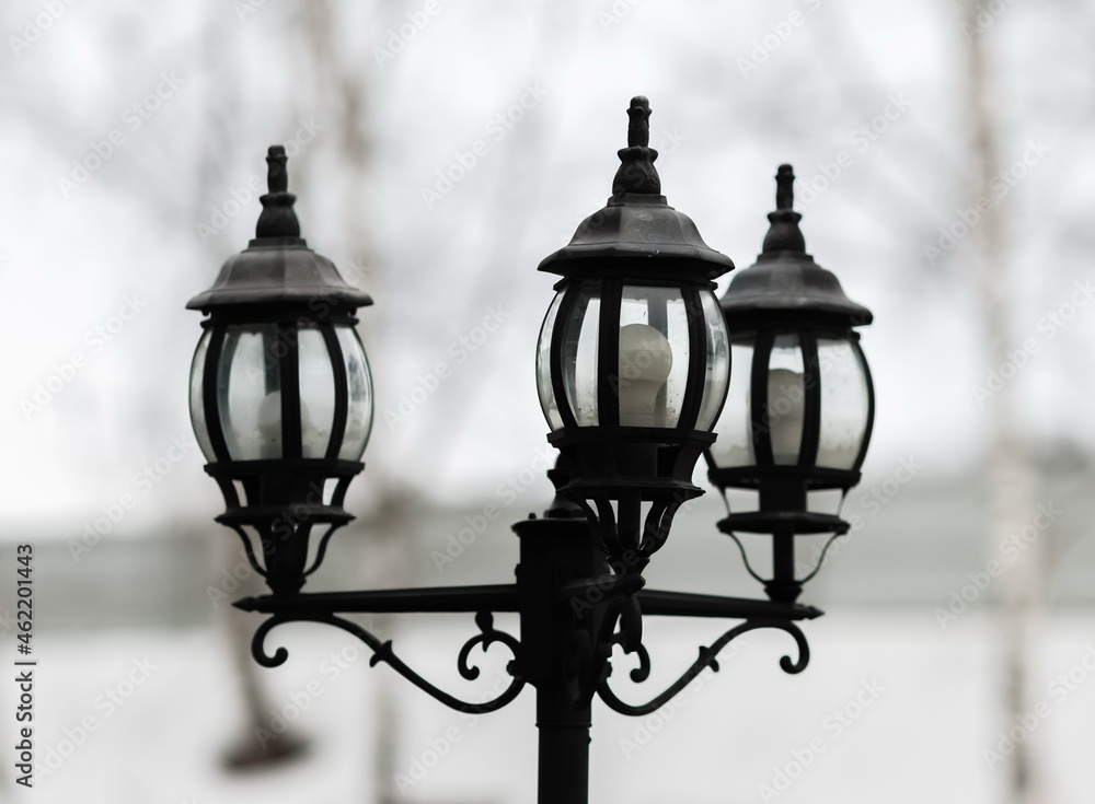 Street lamp close-up on a white background in winter