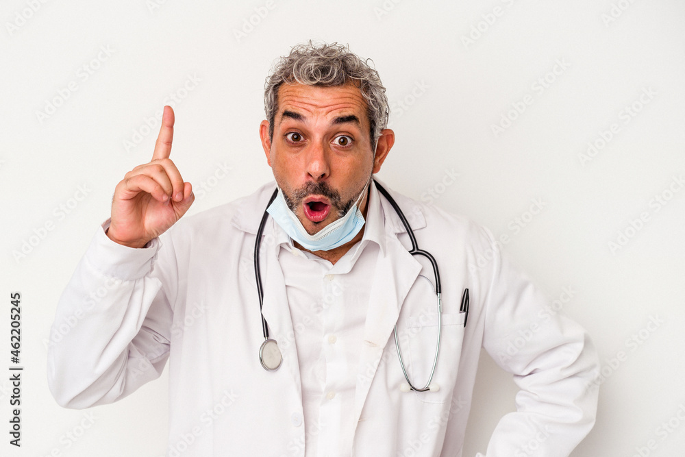 Middle age doctor man wearing a mask for virus isolated on white background having an idea, inspiration concept. Middle age doctor man wearing a mask for virus isolated on white background having an idea, inspiration concept.