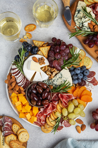 Appetizers boards with assorted cheese  meat  grape and nuts.