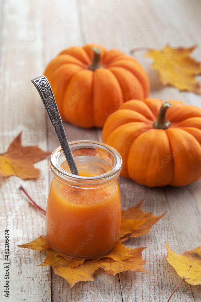 Pumpkin puree in jar, mashed butternut squash. Autumn food concept Pumpkin puree in jar, mashed butternut squash. Autumn food concept