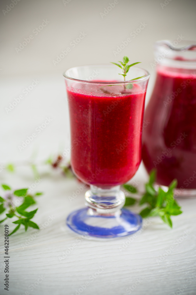 freshly squeezed thick natural juice with pulp from ripe red viburnum in a decanter freshly squeezed thick natural juice with pulp from ripe red viburnum in a decanter