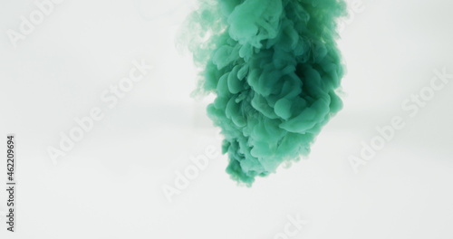 Green cloud of smoke moving on white background