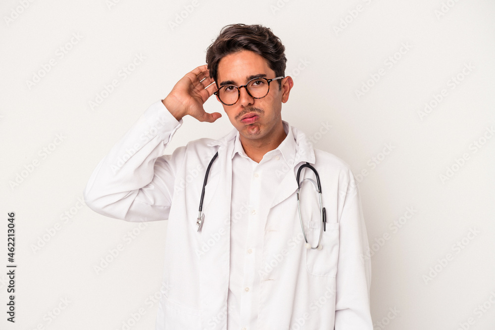 Young mixed race doctor man isolated on white background being shocked, she has remembered important meeting. Young mixed race doctor man isolated on white background being shocked, she has remembered important meeting.