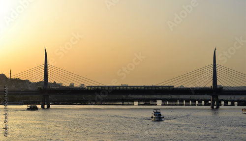 Bridge on Golden Horn with boats underneath in Istanbul,Turkey. Halic bridge in Istanbul.