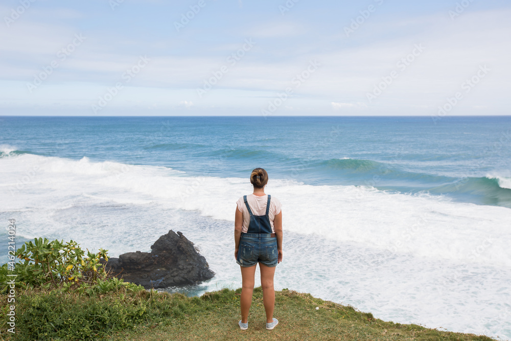 Freedom traveler woman on top of the mountain and enjoy the beautiful seascape. Mauritius