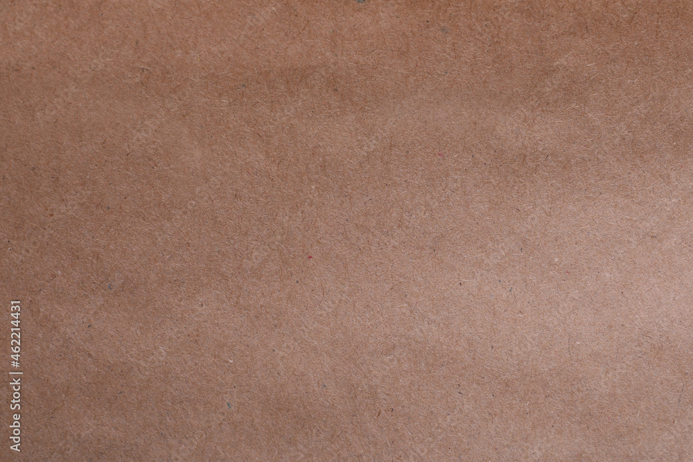 Fototapeta premium Texture of kraft paper bag as background, closeup