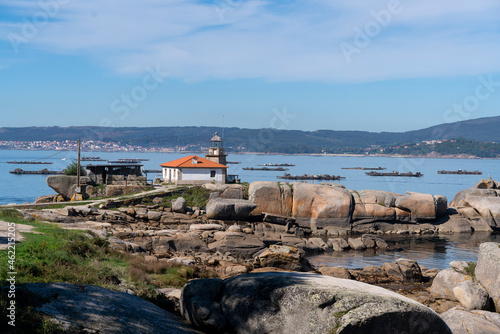 Punta Cabalo lighthouse in Illa de Arousa, Galicia, Spain photo