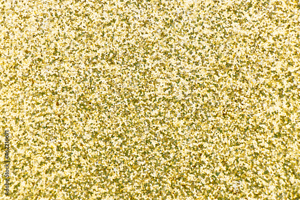 Closed up of metallic gold glitter textured background Closed up of metallic gold glitter textured background