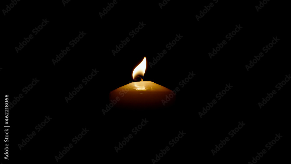 Close up Burning candle isolated on black background Close up Burning candle isolated on black background