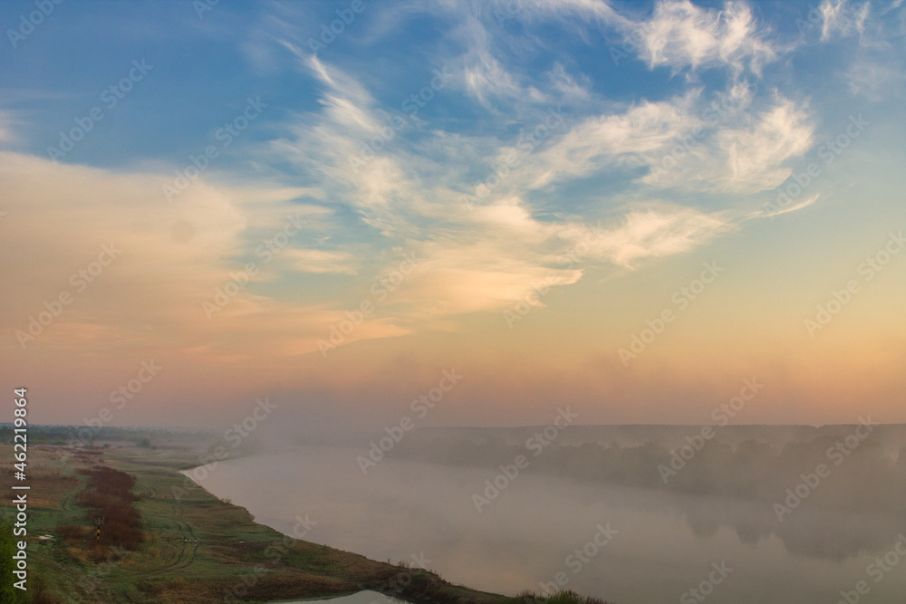 morning fog over the river floodplain in autumn