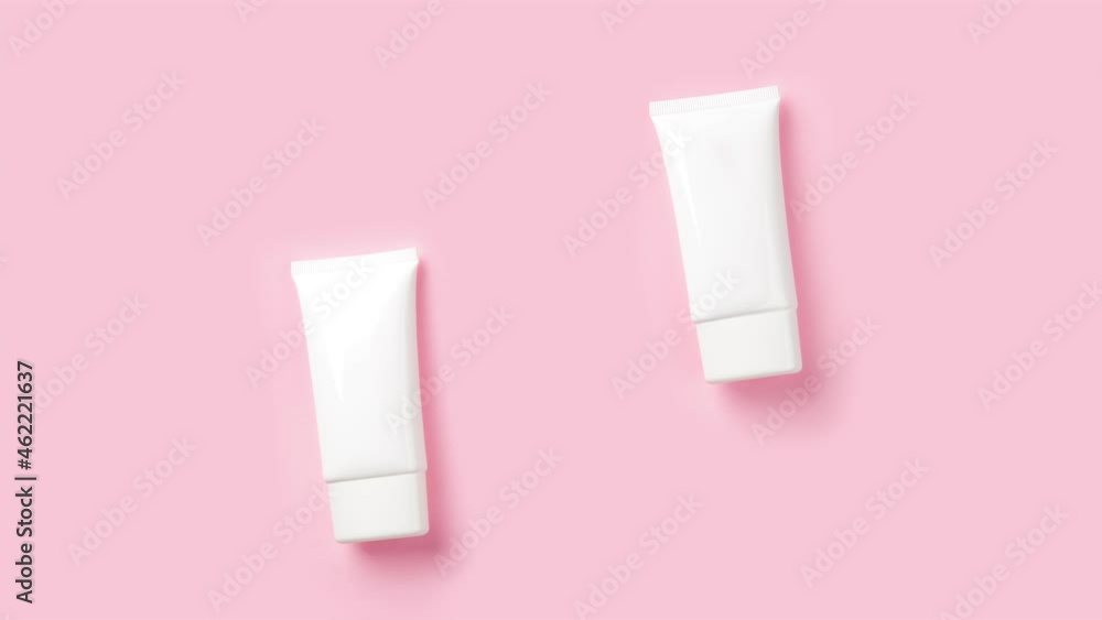 Stop Motion Animation with White Tube of Cosmetic Cream on Pink Background Stop Motion Animation with White Tube of Cosmetic Cream on Pink Background