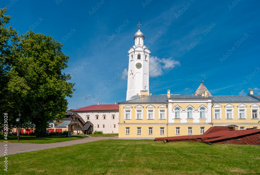 Clock tower of the Novgorod Kremlin. Church of St. Sergius of Radonezh at Vladychny Dvor on the territory of Novgorod Detinets.