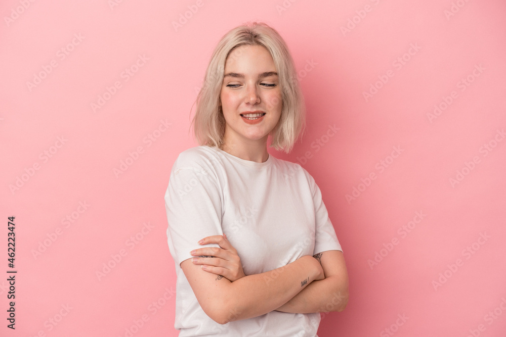 Young caucasian woman isolated on pink background laughing and having fun. Young caucasian woman isolated on pink background laughing and having fun.