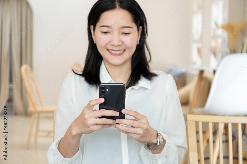 woman work using cell phone hand holding mobile texting message contact us.chatting,search internet information in office.technology device communication connecting woman work using cell phone hand holding mobile texting message contact us.chatting,search internet information in office.technology device communication connecting