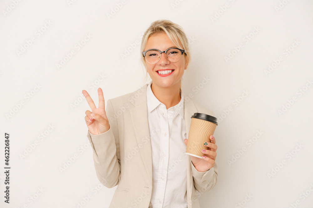 Young business Russian woman holding take away coffee isolated on white background showing number two with fingers. Young business Russian woman holding take away coffee isolated on white background showing number two with fingers.
