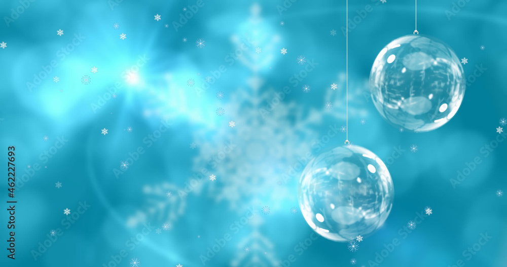 Image of christmas balls over snowflakes on blue background Image of christmas balls over snowflakes on blue background