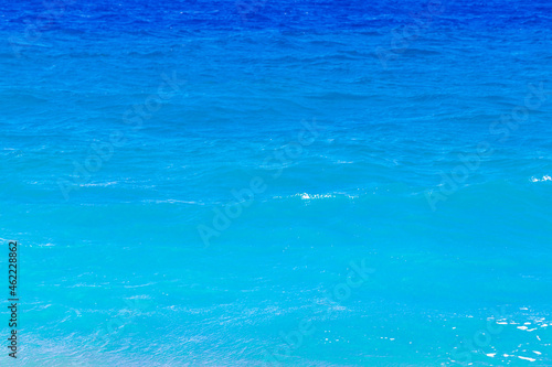 Elli beach texture of blue turquoise clear water Rhodes Greece. © arkadijschell