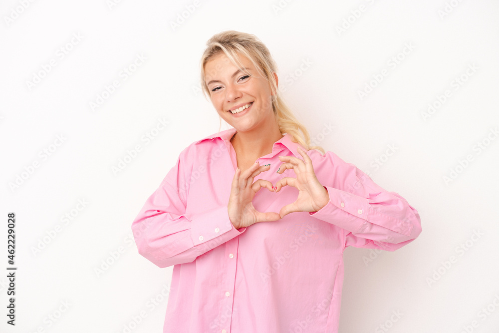 Young Russian woman isolated on white background smiling and showing a heart shape with hands. Young Russian woman isolated on white background smiling and showing a heart shape with hands.