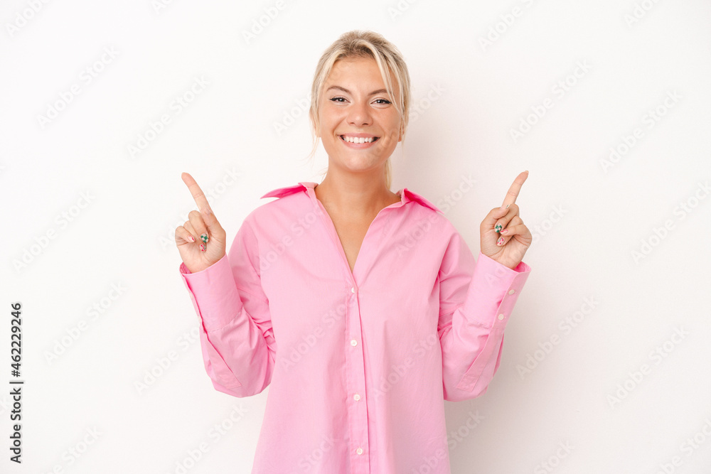 Young Russian woman isolated on white background pointing to different copy spaces, choosing one of them, showing with finger. Young Russian woman isolated on white background pointing to different copy spaces, choosing one of them, showing with finger.
