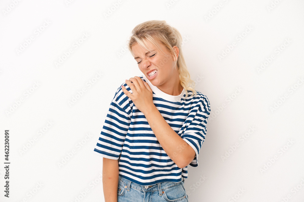 Young Russian woman isolated on white background having a shoulder pain. Young Russian woman isolated on white background having a shoulder pain.