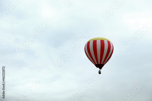 View of hot air balloon in blue sky, space for text