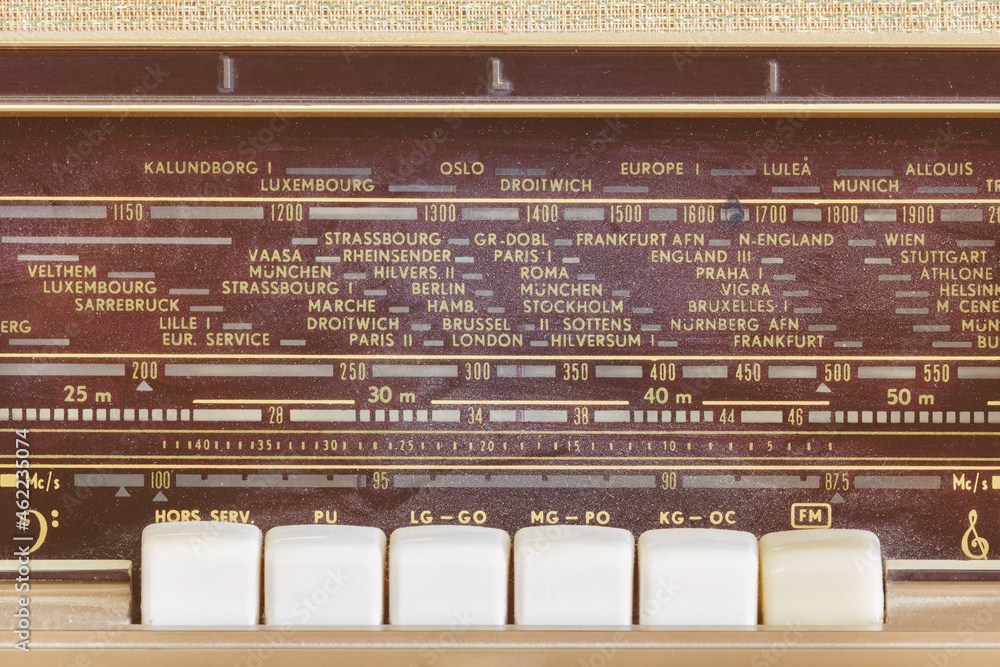 Close up view of a vintage radio with display showing European cities