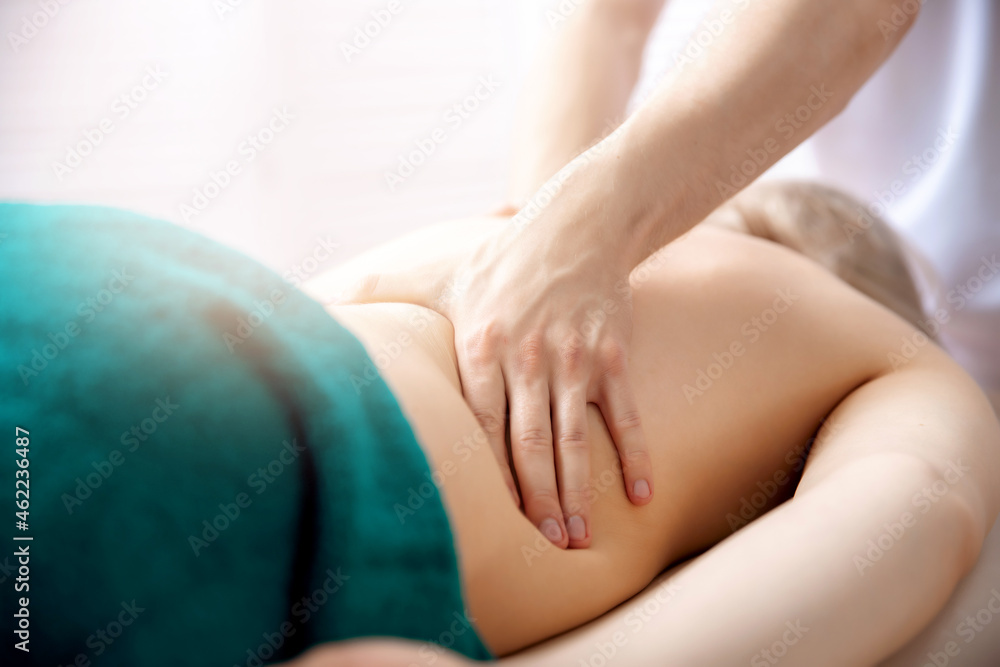 Young woman relaxing with hand professional back massage beauty spa Young woman relaxing with hand professional back massage beauty spa