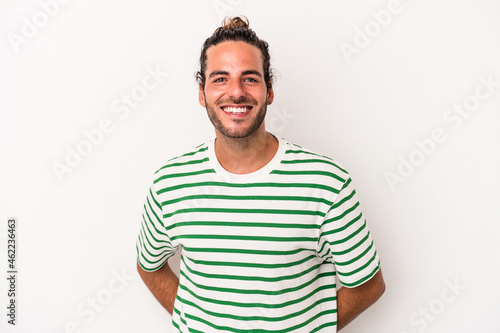 Young caucasian man isolated on white background happy, smiling and cheerful.
