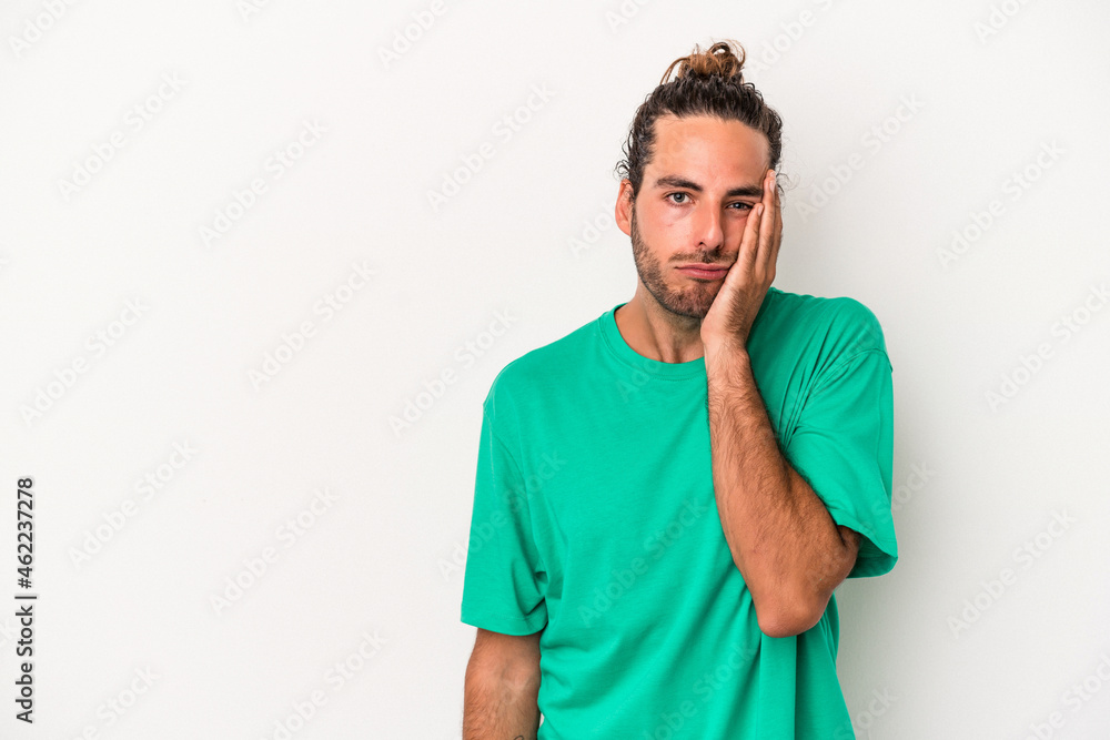 Young caucasian man isolated on white background who feels sad and pensive, looking at copy space. Young caucasian man isolated on white background who feels sad and pensive, looking at copy space.