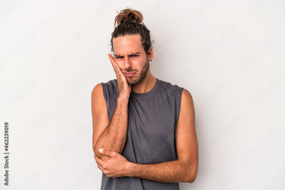 Young caucasian man isolated on gray background who is bored, fatigued and need a relax day. Young caucasian man isolated on gray background who is bored, fatigued and need a relax day.