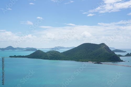Panoramic view with island on blue sky and clouds