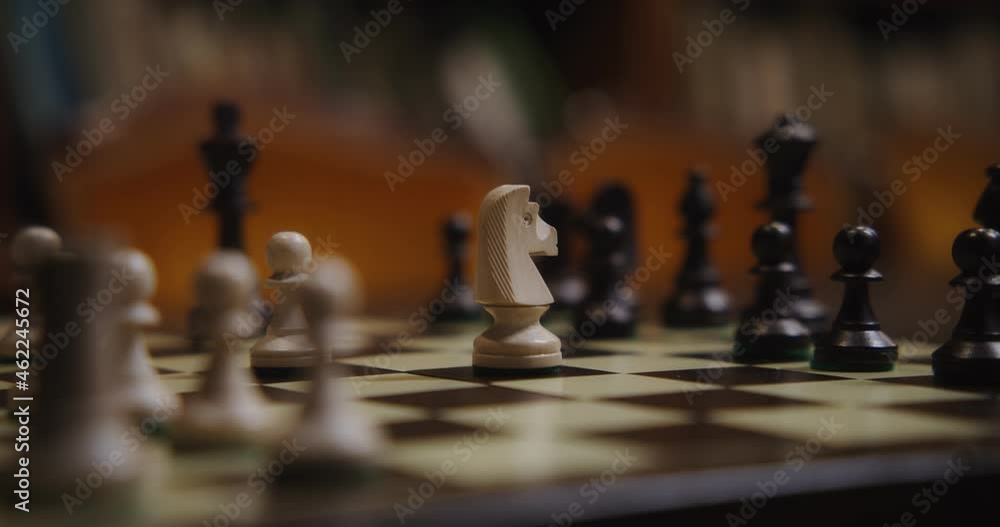 Close-up of rearranging chess pieces Close-up of rearranging chess pieces