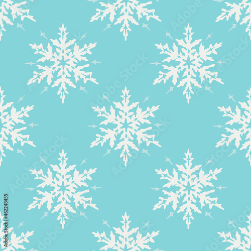 Vector seamless pattern with white snowflakes on blue background. Fancy design.