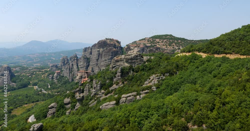 Meteora monasteries. Beautiful view of the Monastery of the Holy Trinity placed on the edge of a high rock covered Kastraki, mainland Greece