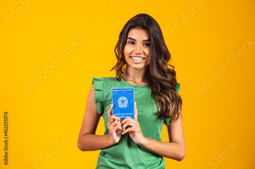 young girl holding the brazilian work card photo