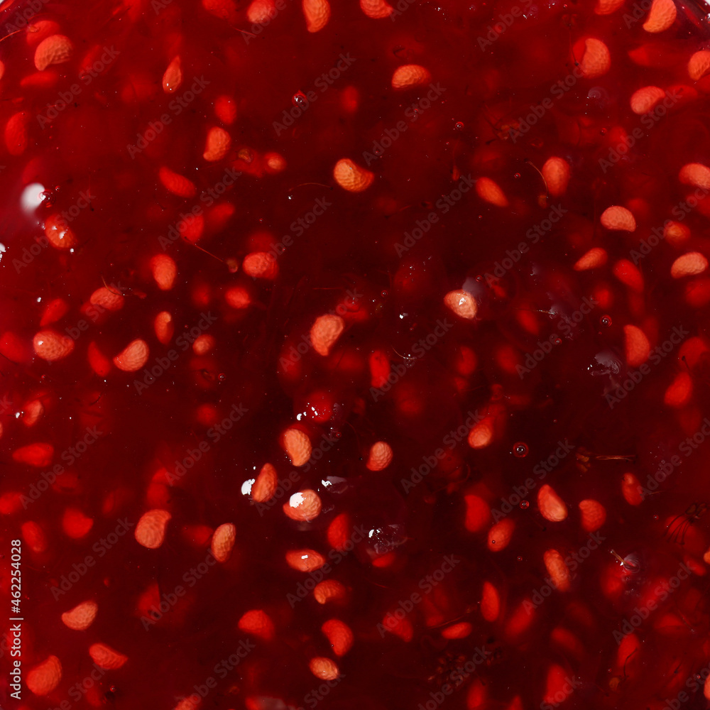 Raspberry jam all over background, top view Raspberry jam all over background, top view