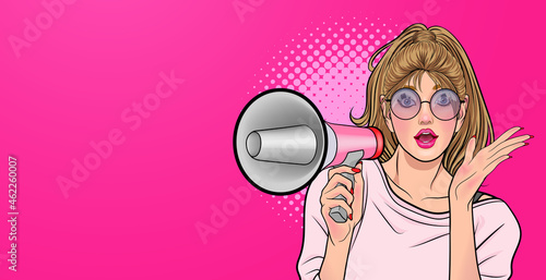 Amazed Pop art girl in glasses with megaphone saying something