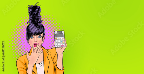 Amazed young woman holding calculator Wow and surprised concept