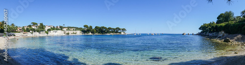 ra wide view of the beautiful Fosses Beach in Saint Jean Cap Ferrat with tropical colored water
