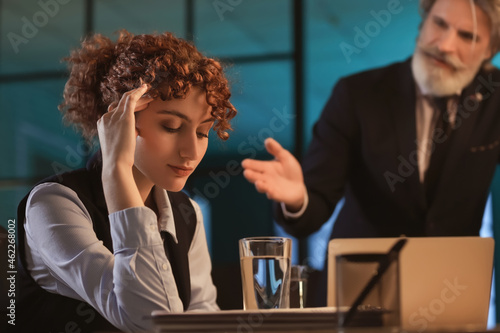 Tired businesswoman working...