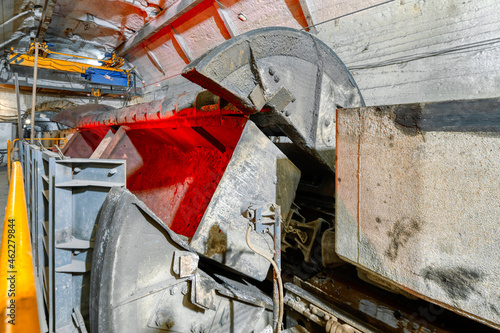 Rotating unloader of railway underground cars photo